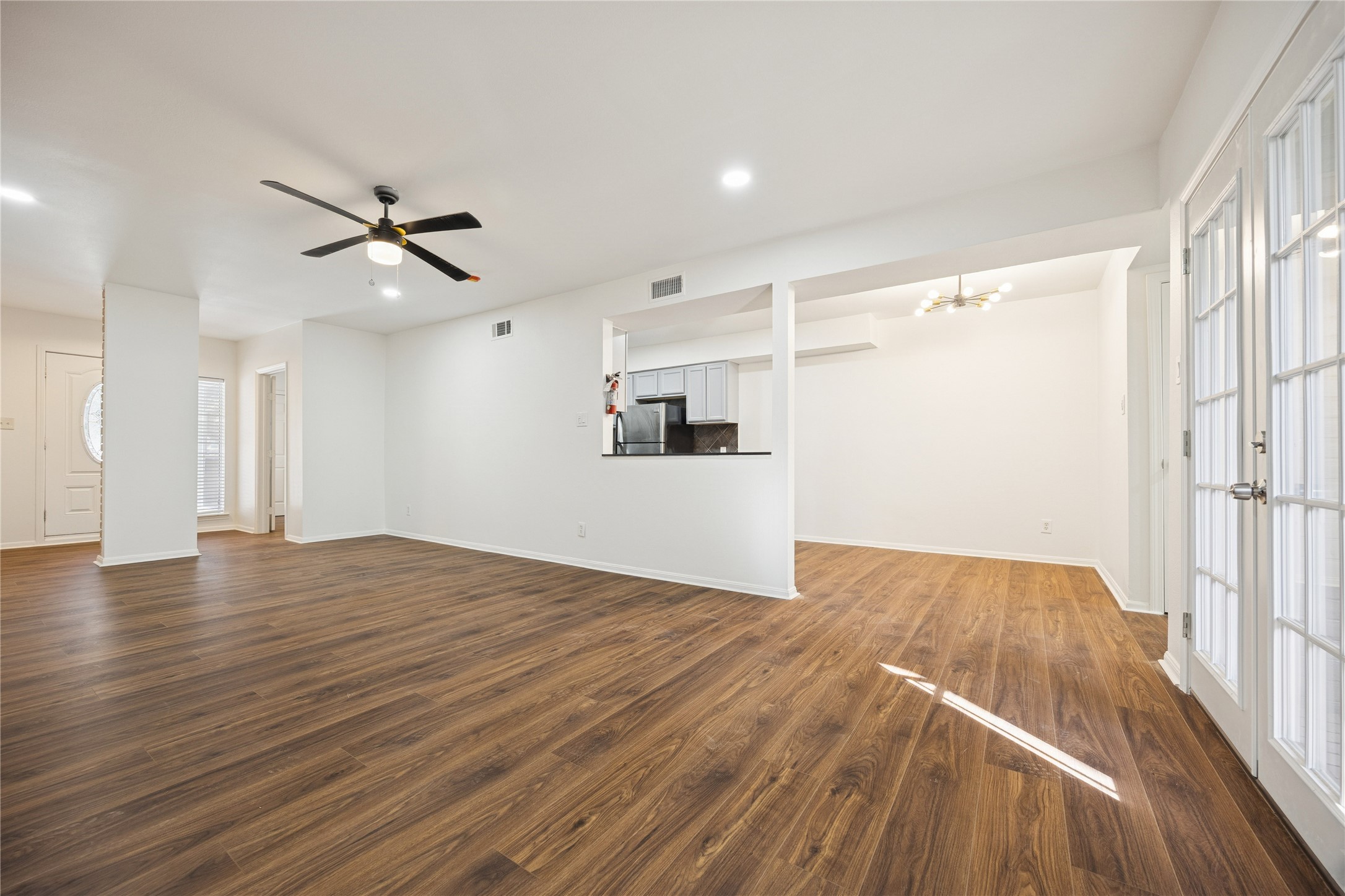 705 Harold Street, Unit 1 Houston, TX 77006 - Photo 3 of 16 wooden floor in an empty room with a window