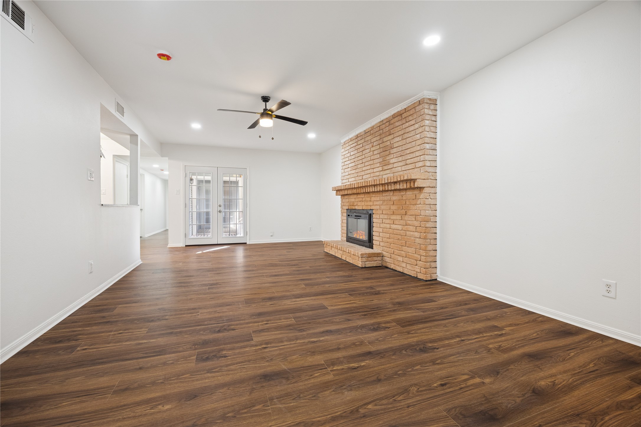705 Harold Street, Unit 1 Houston, TX 77006 - Photo 8 of 16 a view of empty room with wooden floor and fan