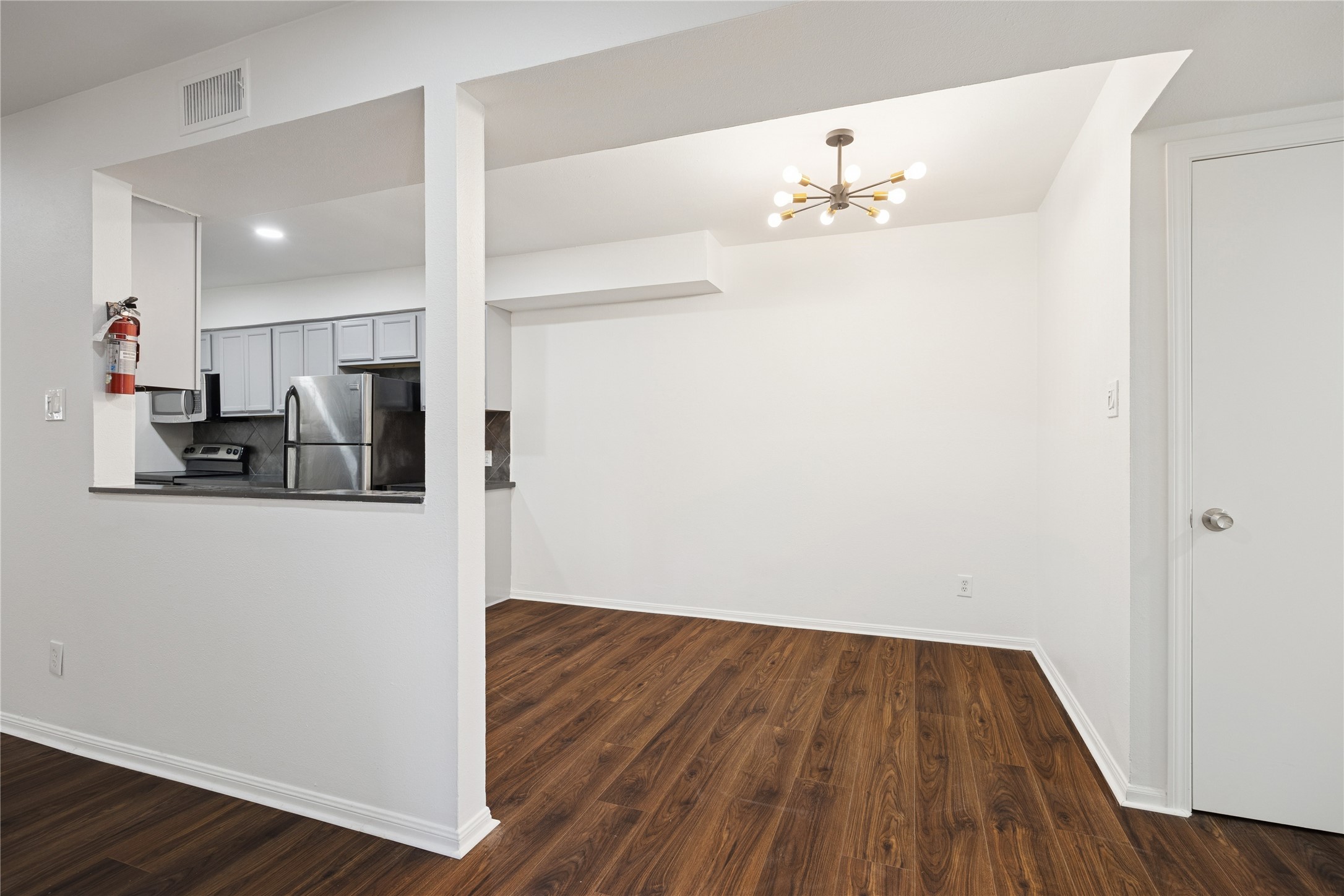 705 Harold Street, Unit 1 Houston, TX 77006 - Photo 10 of 16 a view of kitchen with wooden floor