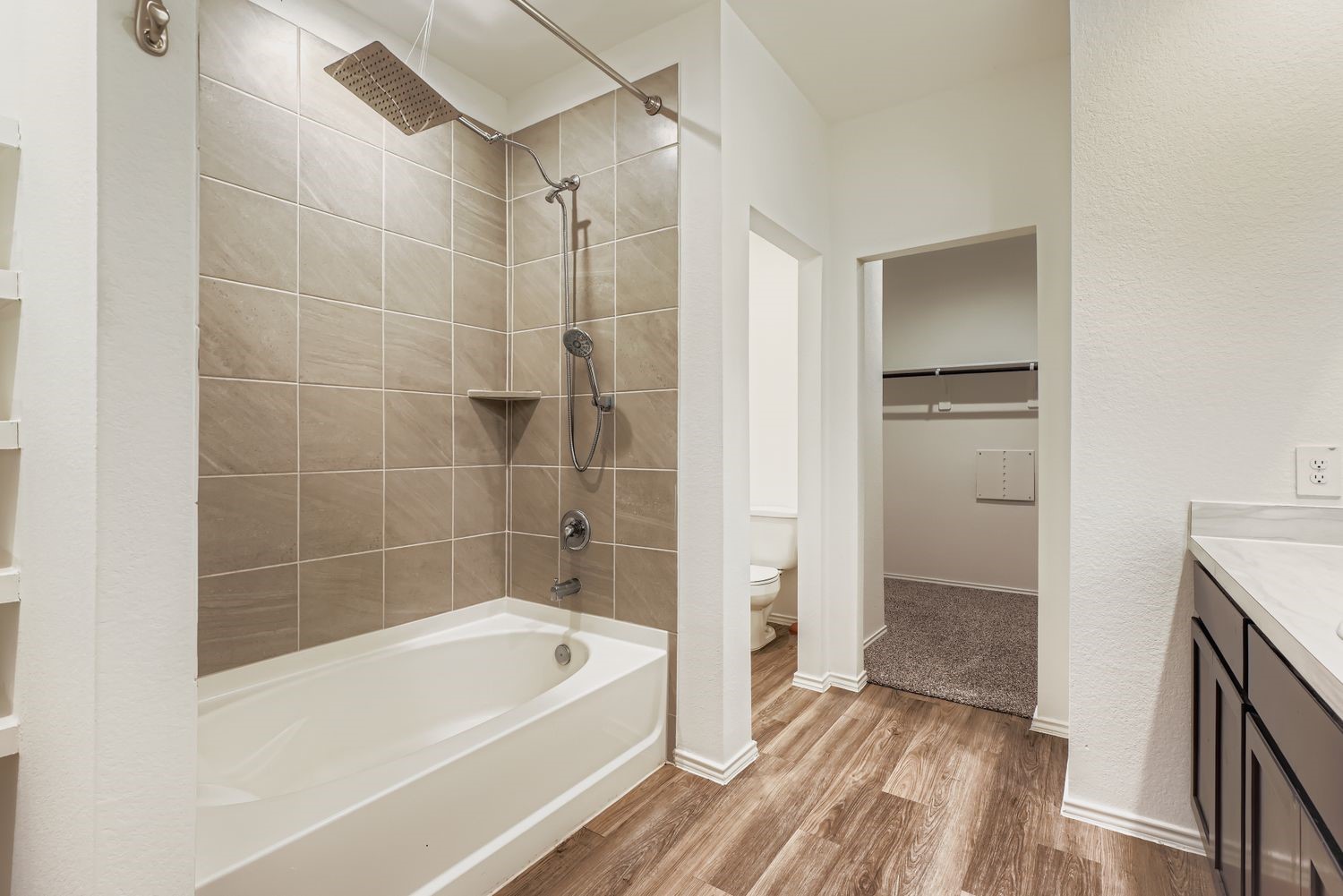 1726 Windstone Ridge Drive Houston, TX 77014 - Photo 13 of 28 a bathroom with a bathtub a toilet and a shower