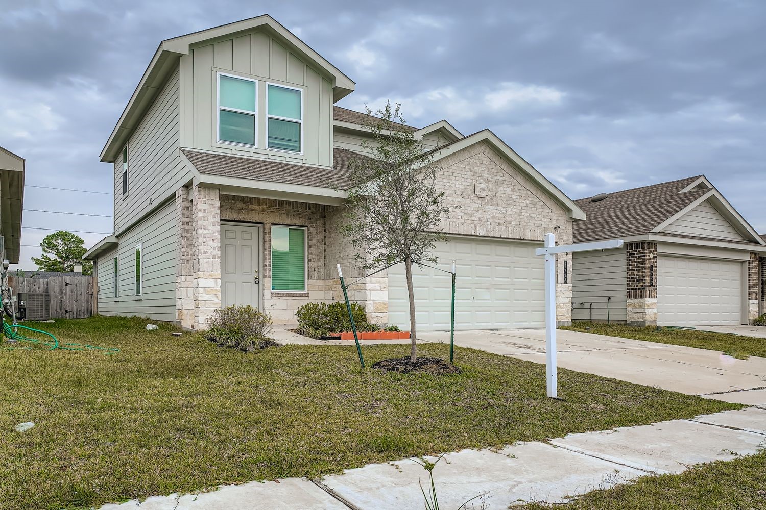 1726 Windstone Ridge Drive Houston, TX 77014 - Photo 2 of 28 a view of a house with a yard