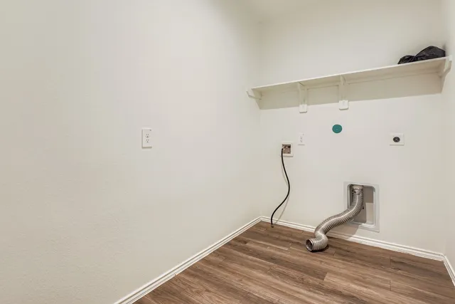 a view of backyard with wooden fence