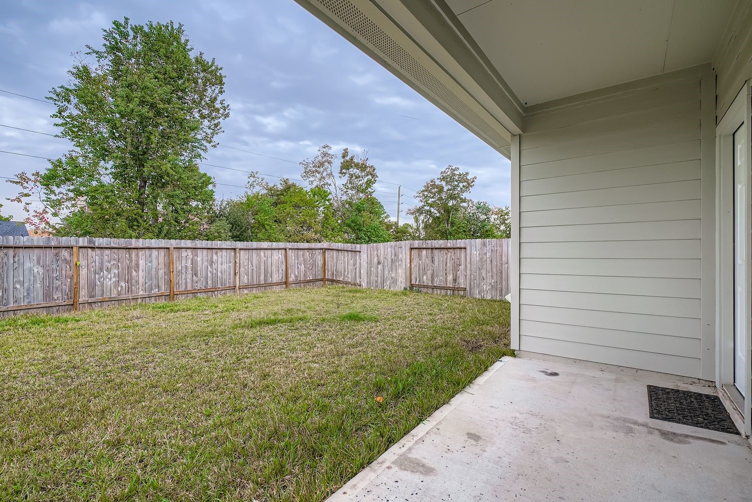 1726 Windstone Ridge Drive Houston, TX 77014 - Photo 26 of 28 a view of backyard with wooden fence