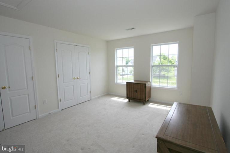 14407 Autumn Gold Road Boyds, MD 20841 - Photo 22 of 24 a view of an empty room with a window