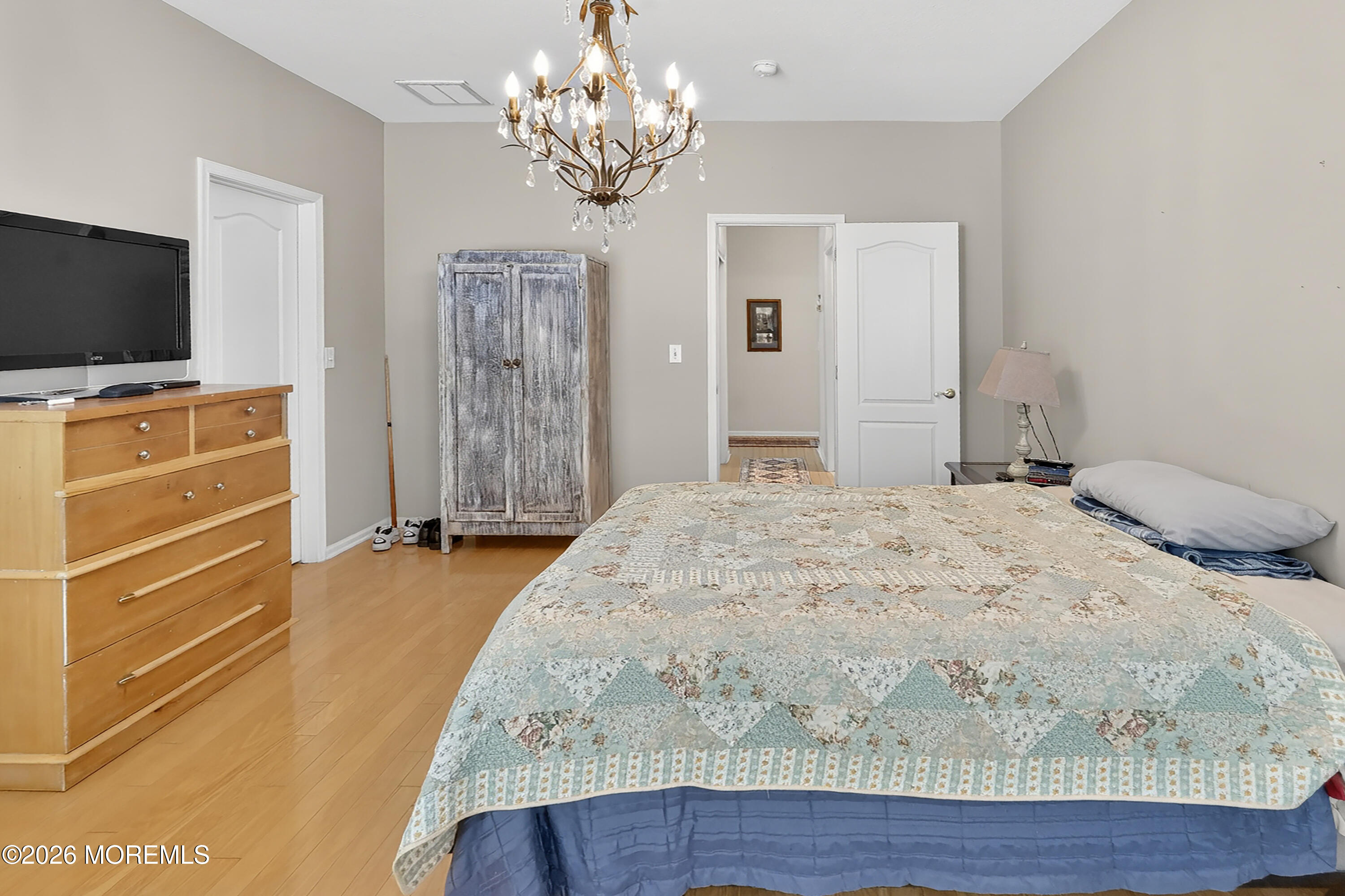 2526 Morningstar Road Manasquan, NJ 08736 - Photo 11 of 17 a bedroom with a bed and a flat screen tv
