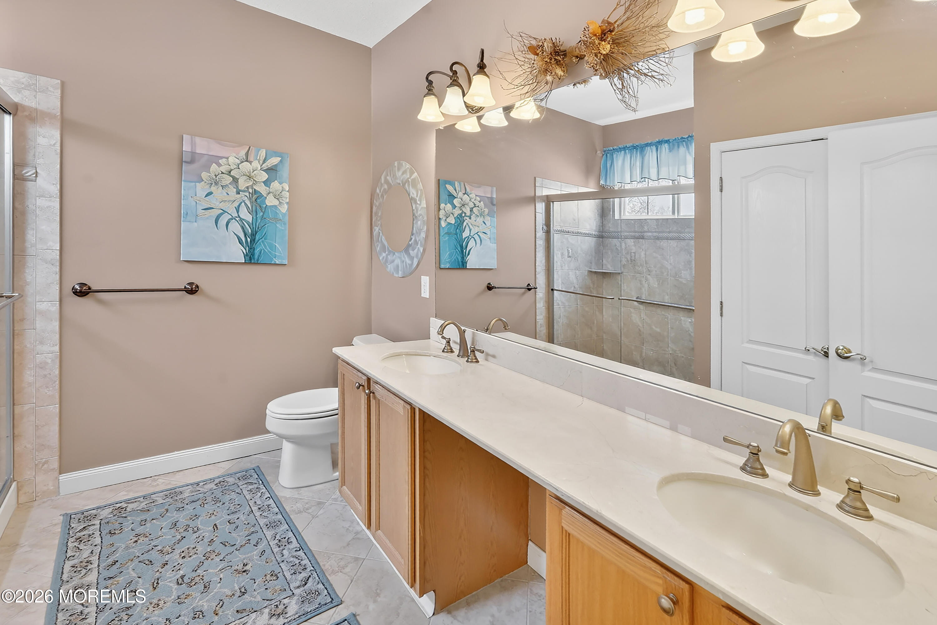 2526 Morningstar Road Manasquan, NJ 08736 - Photo 12 of 17 a bathroom with a sink a toilet and a mirror