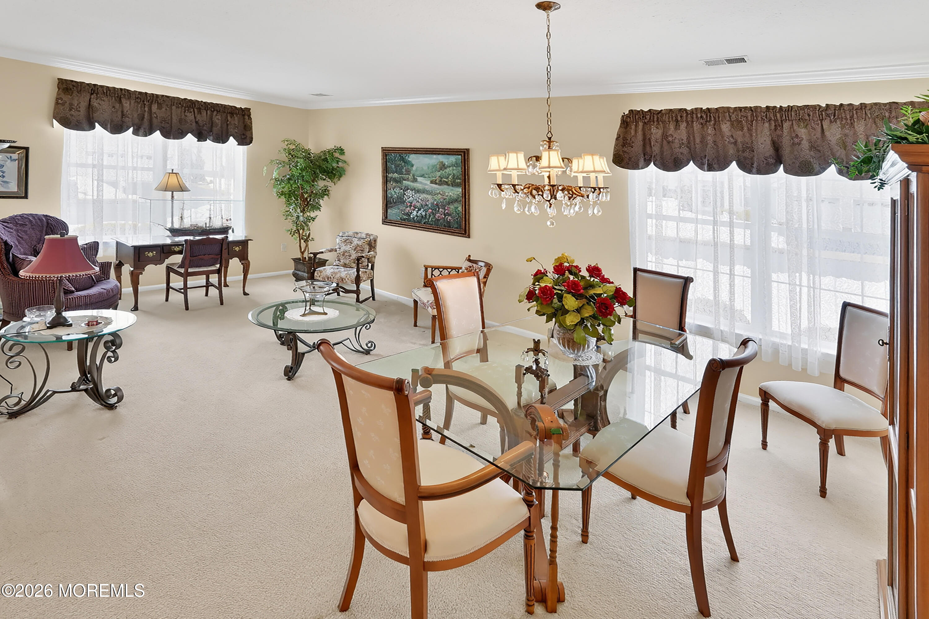 2526 Morningstar Road Manasquan, NJ 08736 - Photo 3 of 17 a view of a dining room with furniture and chandelier