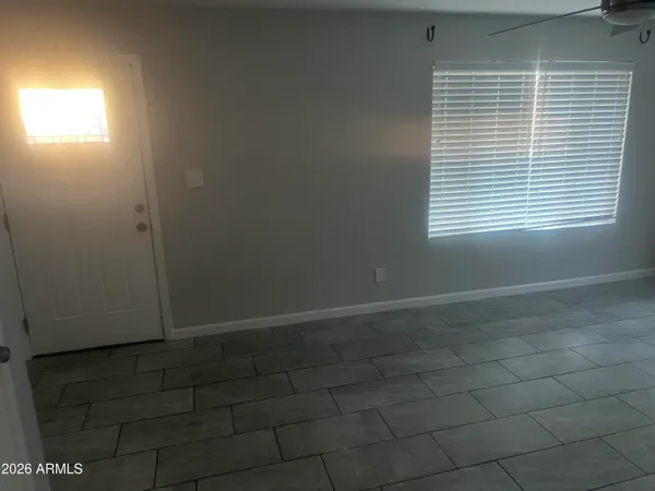 a view of an empty room with a window