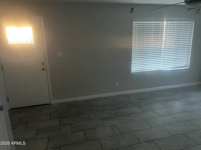 a view of an empty room with a window