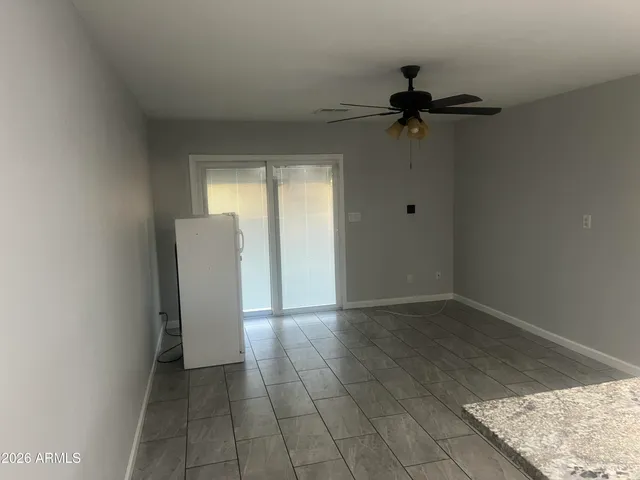 an empty room with a empty space and windows