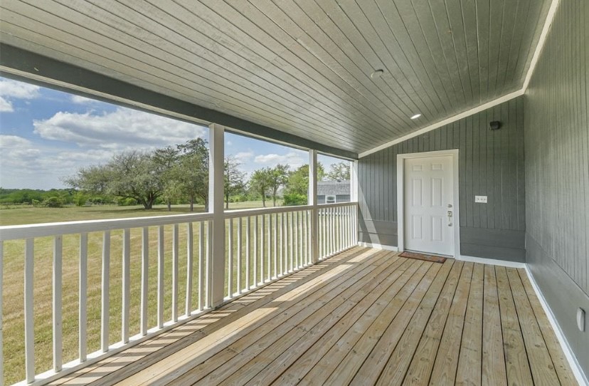 9137 Conner Road Washington, TX 77880 - Photo 12 of 49 a view of balcony with wooden floor