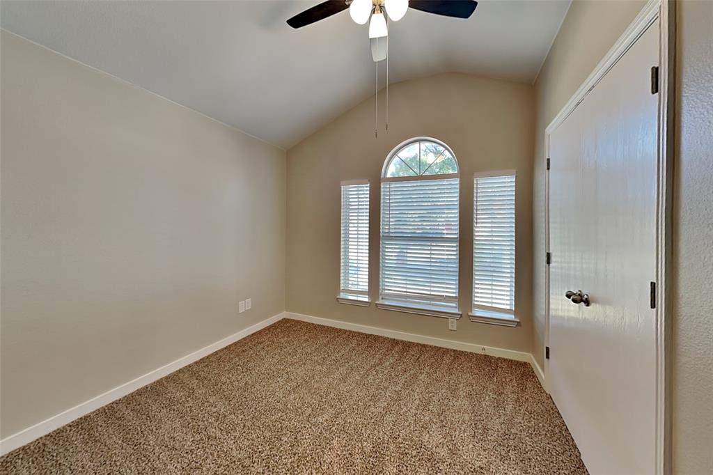 4920 Mountain Ridge Lane McKinney, TX 75071 - Photo 13 of 19 Carpeted empty room featuring lofted ceiling and ceiling fan