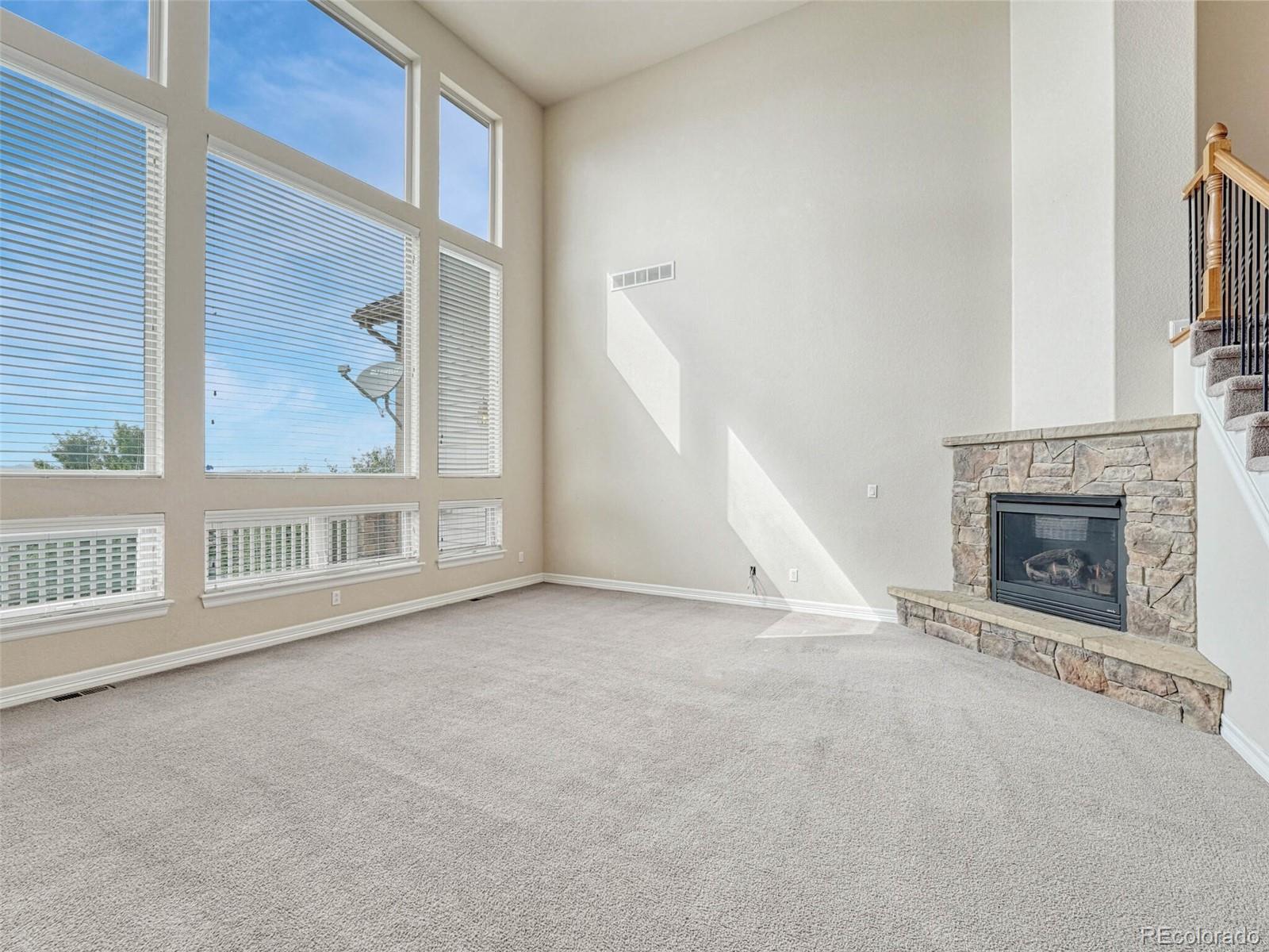 9741 Sunset Hill Circle Lone Tree, CO 80124 - Photo 12 of 43 an empty room with windows