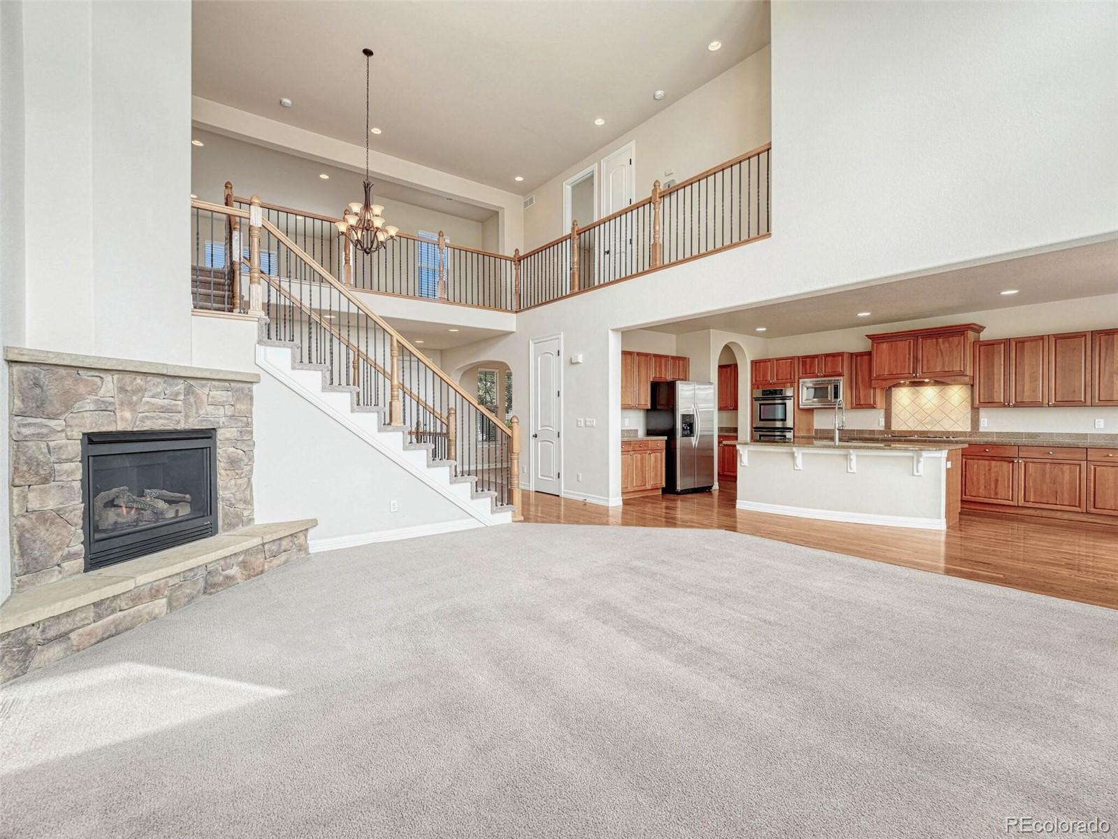 9741 Sunset Hill Circle Lone Tree, CO 80124 - Photo 14 of 43 a view of a kitchen with furniture and a kitchen