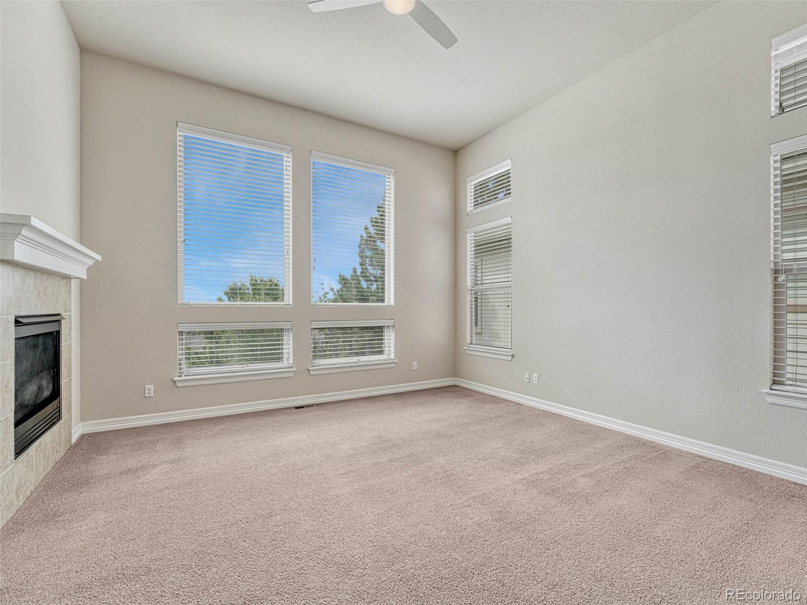 9741 Sunset Hill Circle Lone Tree, CO 80124 - Photo 20 of 43 a view of an empty room with a window