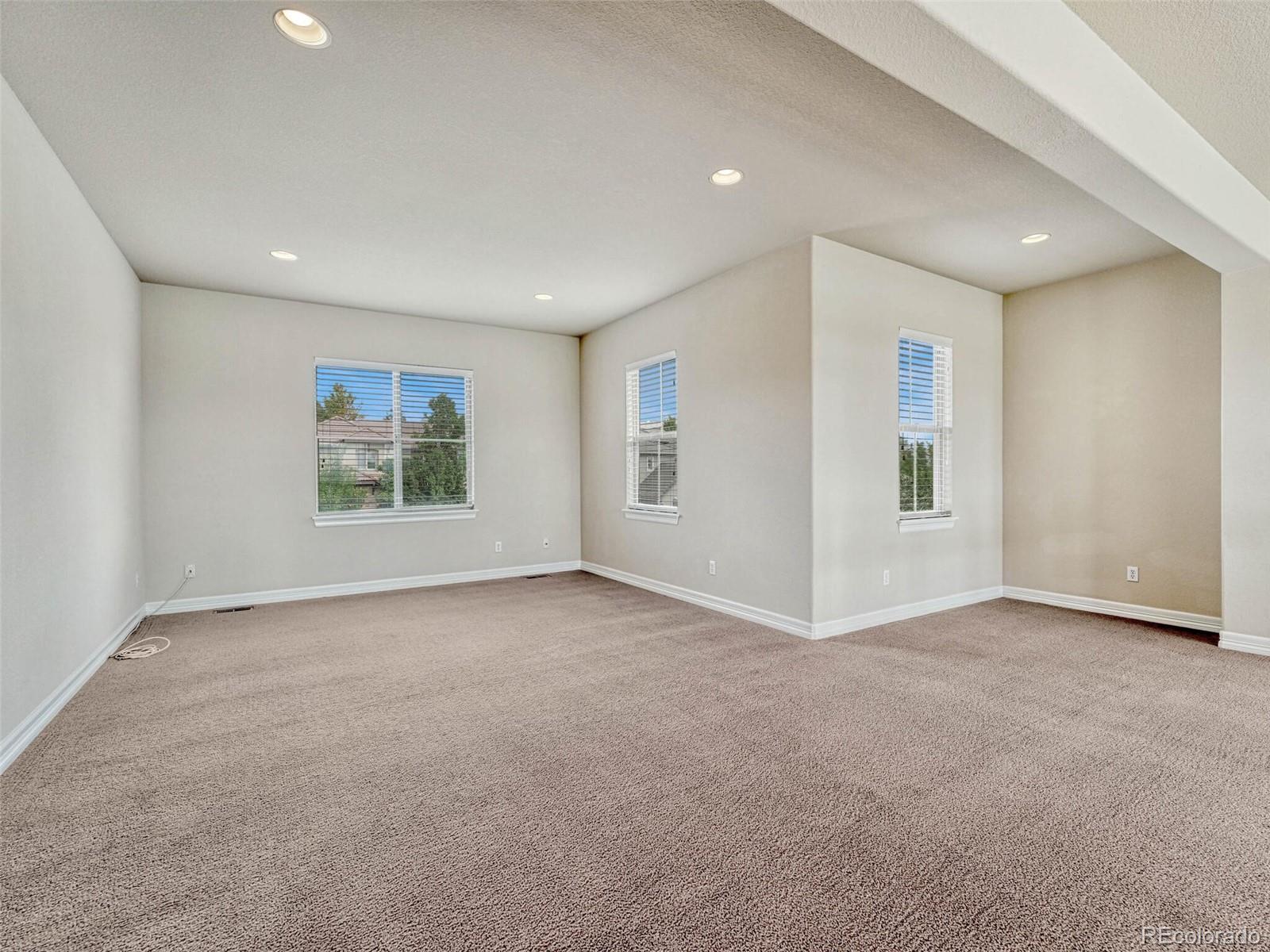 9741 Sunset Hill Circle Lone Tree, CO 80124 - Photo 26 of 43 an empty room with windows and closet