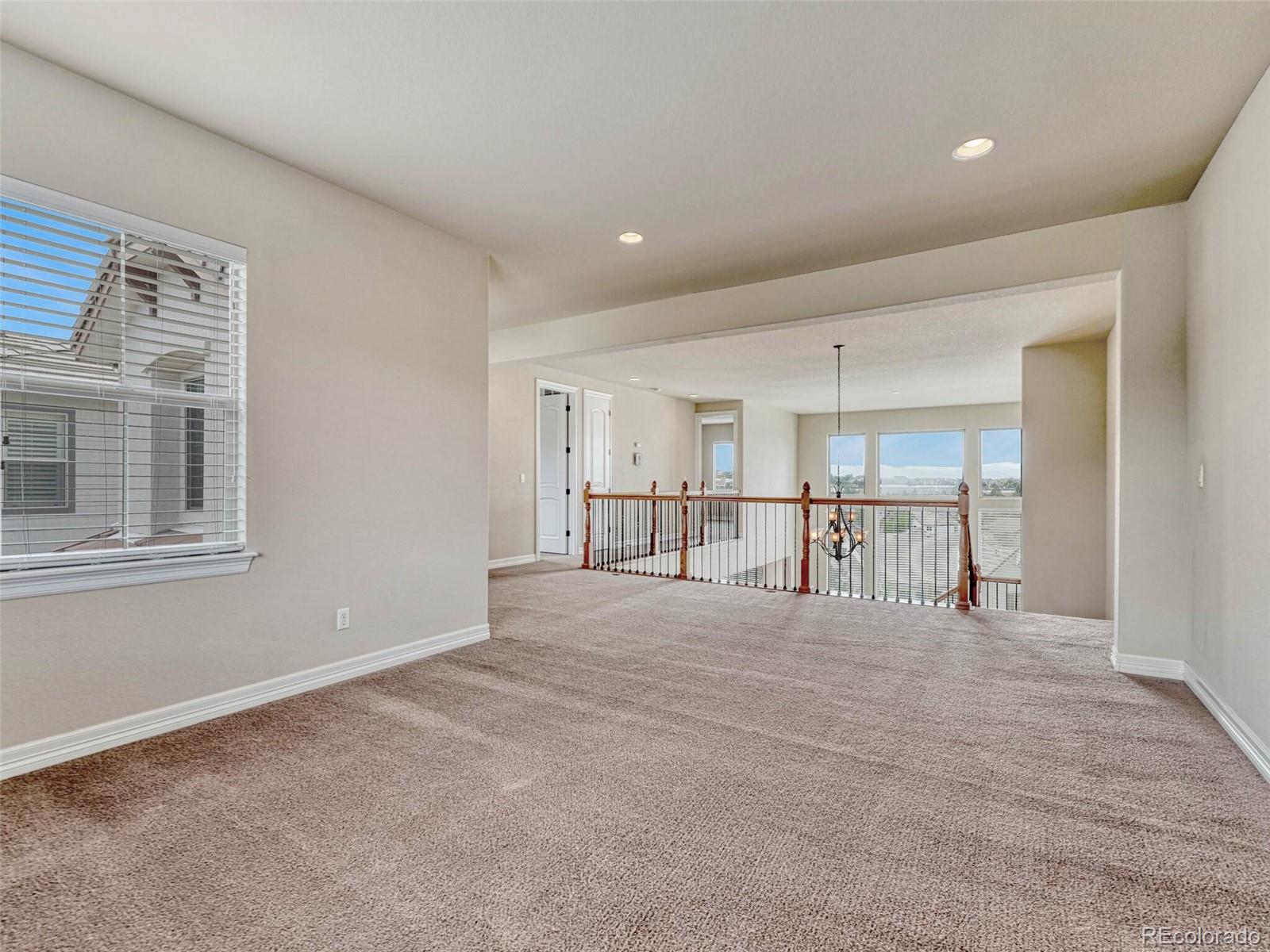 9741 Sunset Hill Circle Lone Tree, CO 80124 - Photo 27 of 43 a view of an empty room with a window