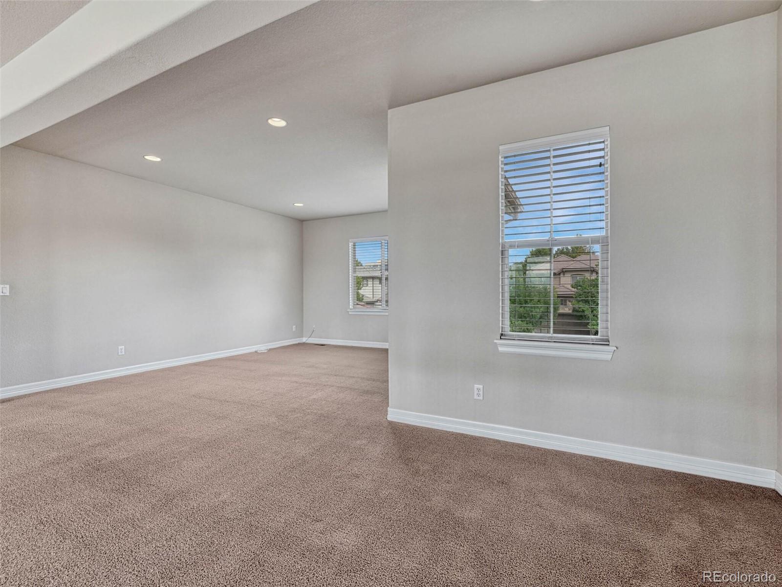 9741 Sunset Hill Circle Lone Tree, CO 80124 - Photo 28 of 43 an empty room with windows