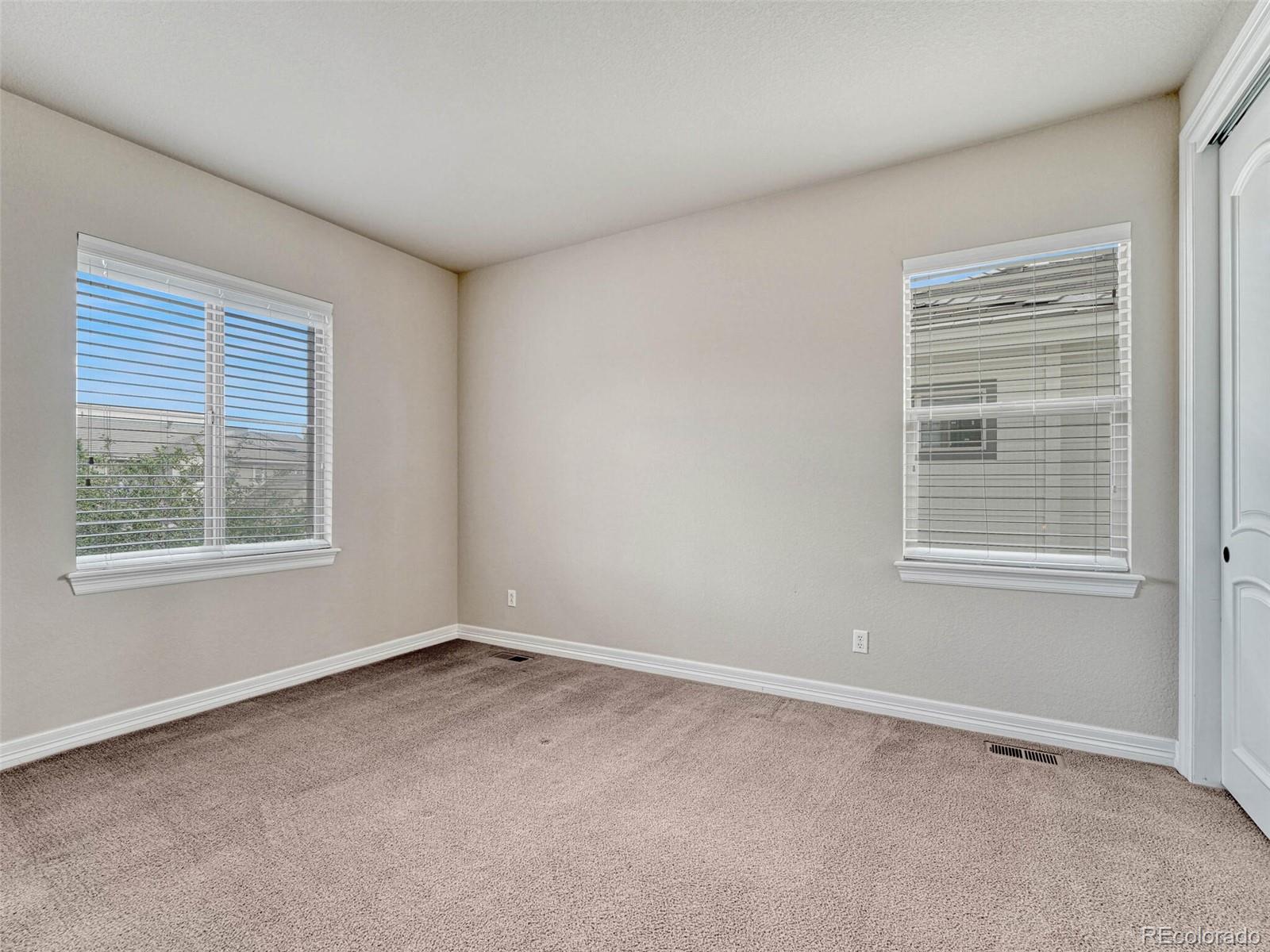 9741 Sunset Hill Circle Lone Tree, CO 80124 - Photo 29 of 43 an empty room with a window