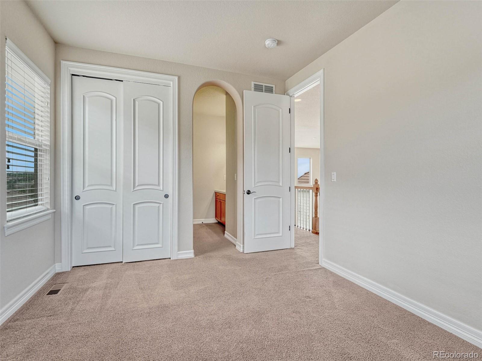 9741 Sunset Hill Circle Lone Tree, CO 80124 - Photo 30 of 43 an empty room with windows