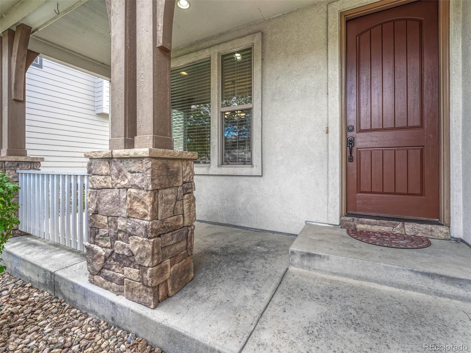 9741 Sunset Hill Circle Lone Tree, CO 80124 - Photo 3 of 43 a view of front door of house