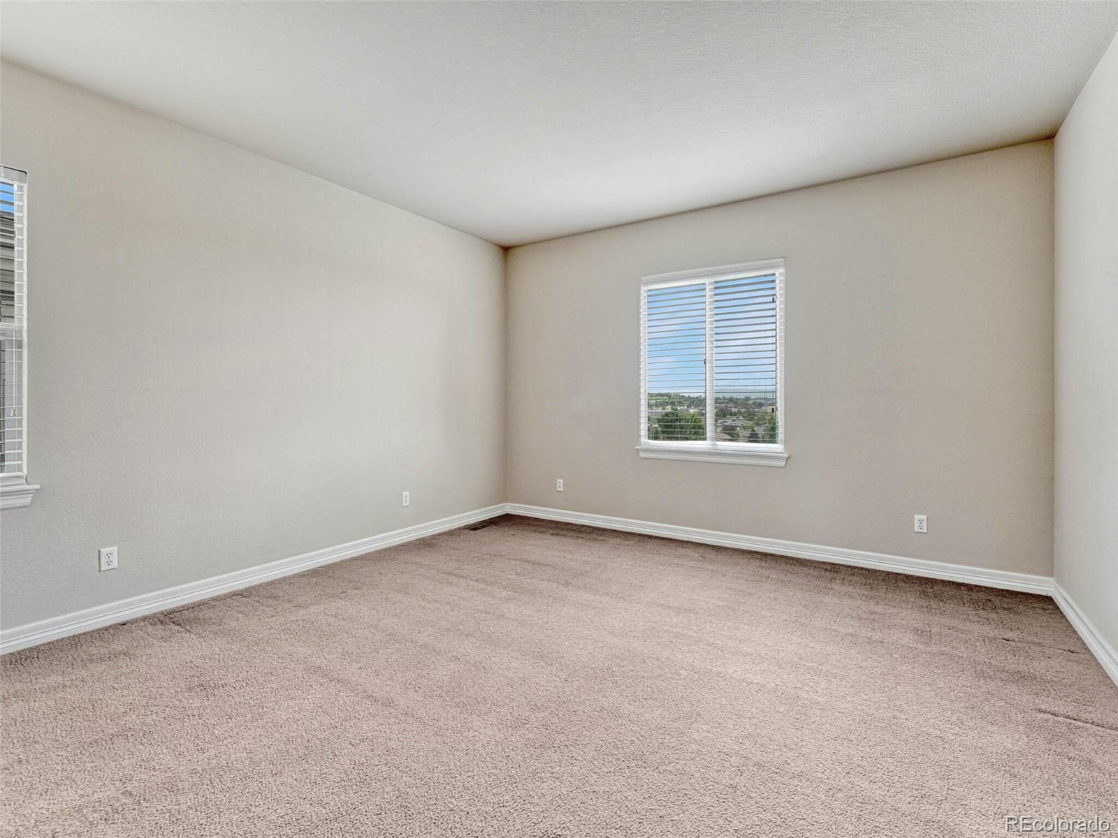 9741 Sunset Hill Circle Lone Tree, CO 80124 - Photo 33 of 43 an empty room with a window