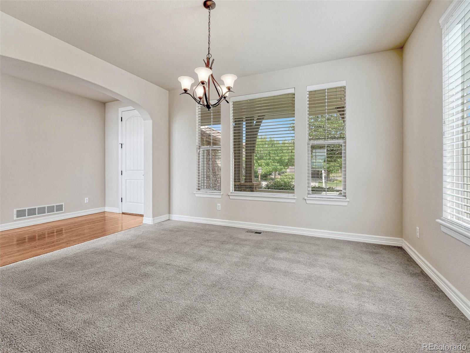 9741 Sunset Hill Circle Lone Tree, CO 80124 - Photo 4 of 43 a view of an empty room with a window
