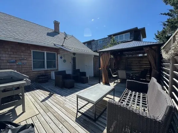 a view of backyard with a patio and outdoor seating