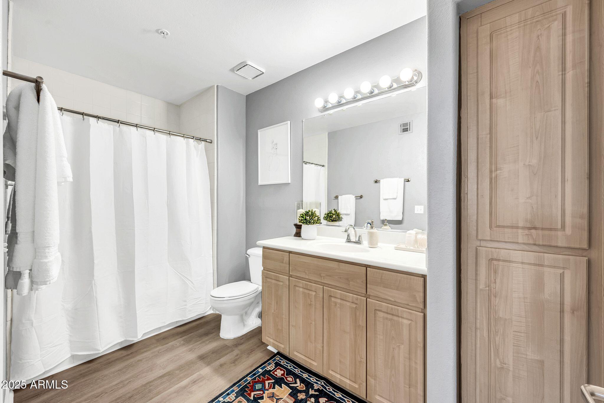 7575 East Indian Bend Road, Unit 2085 Scottsdale, AZ 85250 - Photo 11 of 30 a bathroom with a sink a toilet and shower