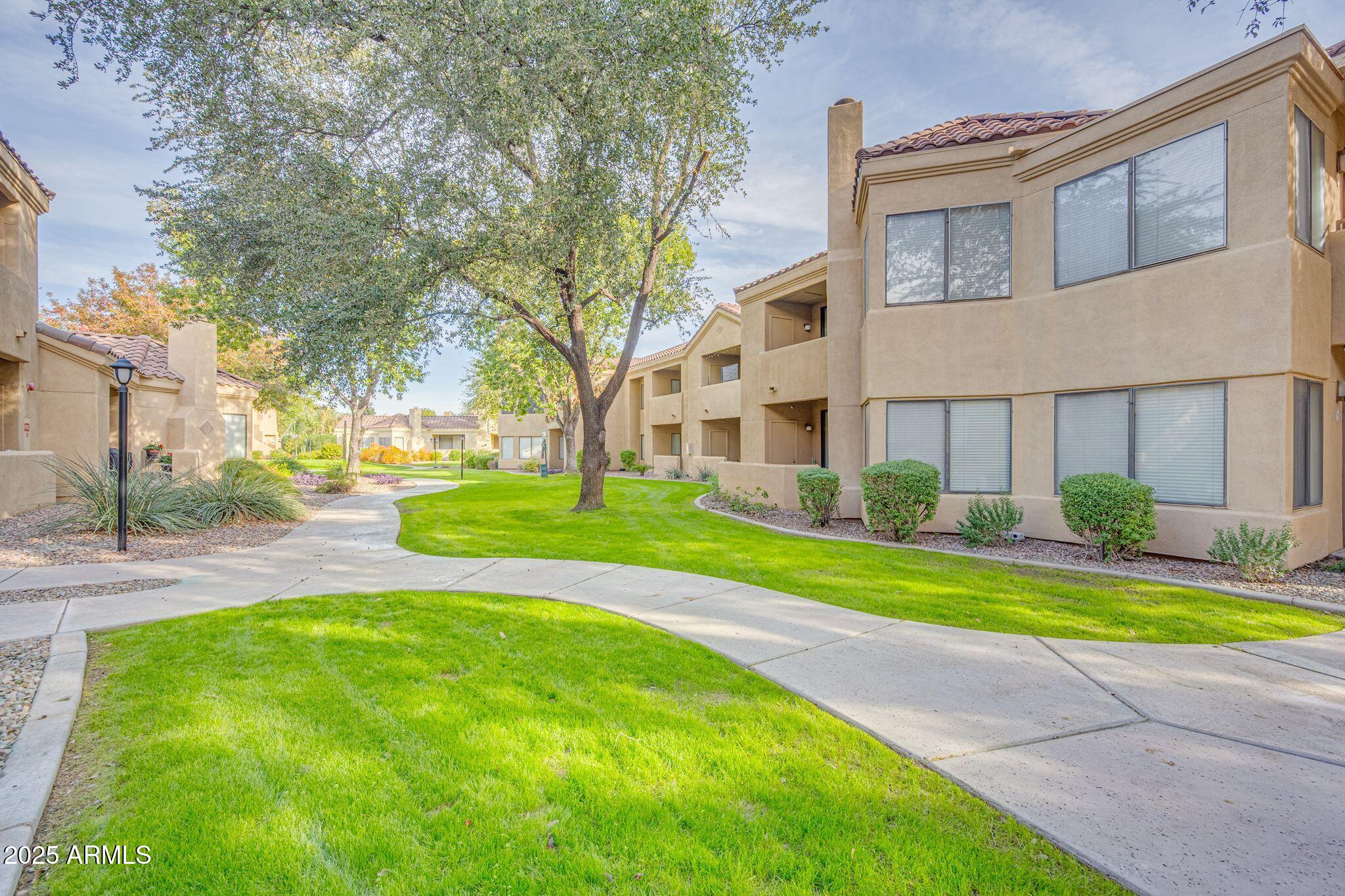 7575 East Indian Bend Road, Unit 2085 Scottsdale, AZ 85250 - Photo 20 of 30 a view of a house with a yard