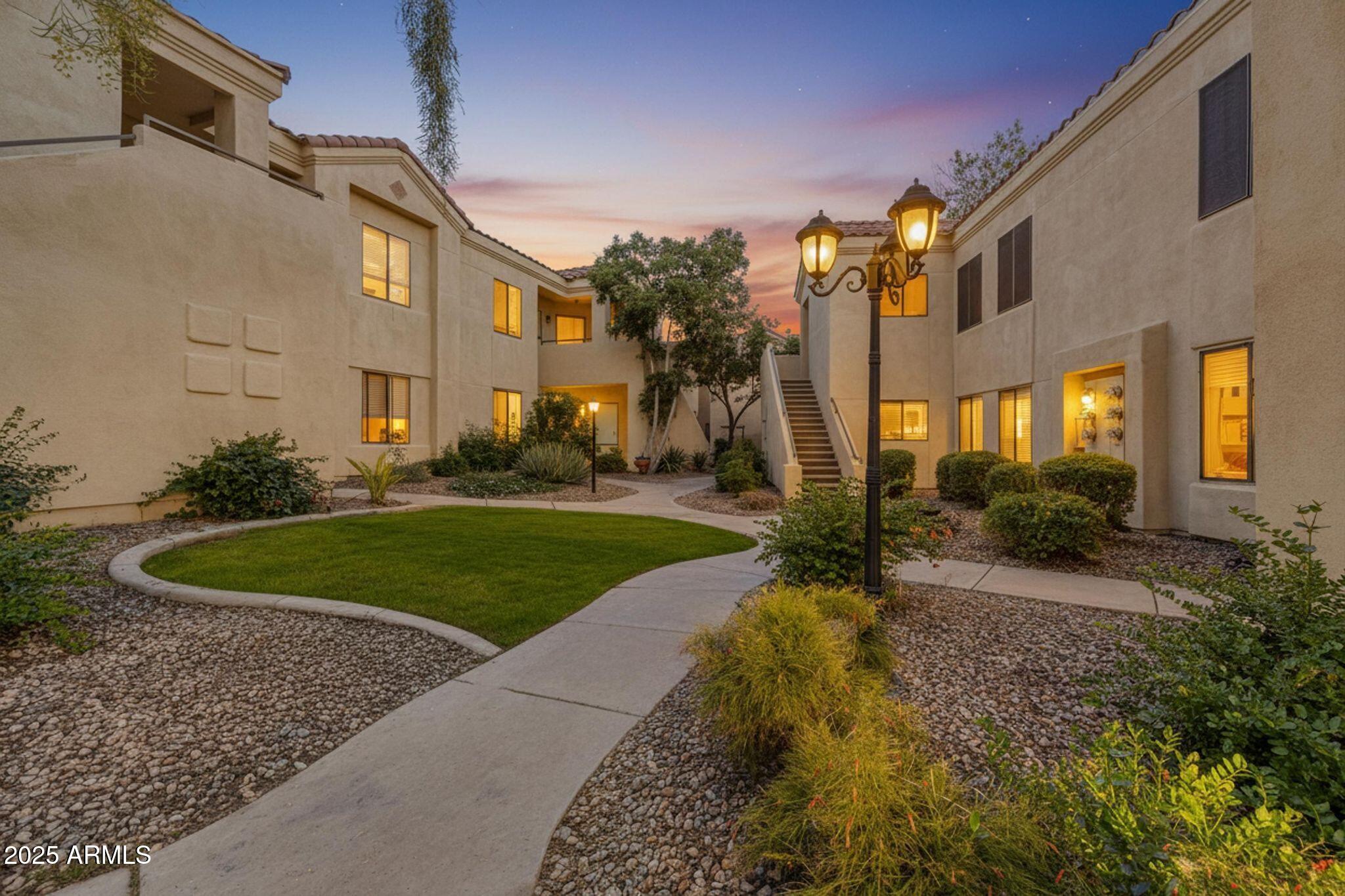 7575 East Indian Bend Road, Unit 2085 Scottsdale, AZ 85250 - Photo 21 of 30 a front view of a house with a yard
