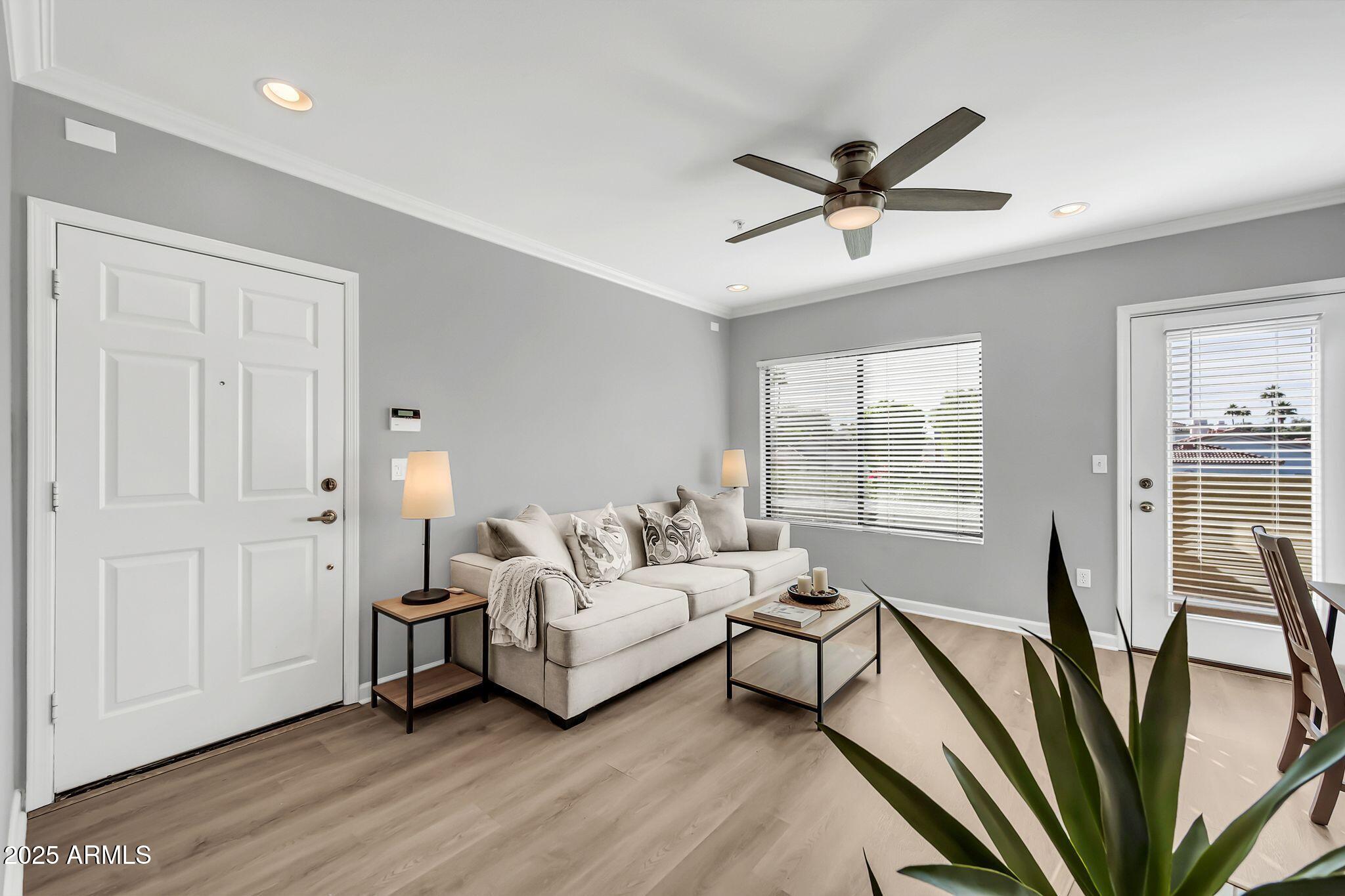 7575 East Indian Bend Road, Unit 2085 Scottsdale, AZ 85250 - Photo 4 of 30 a living room with furniture and a window