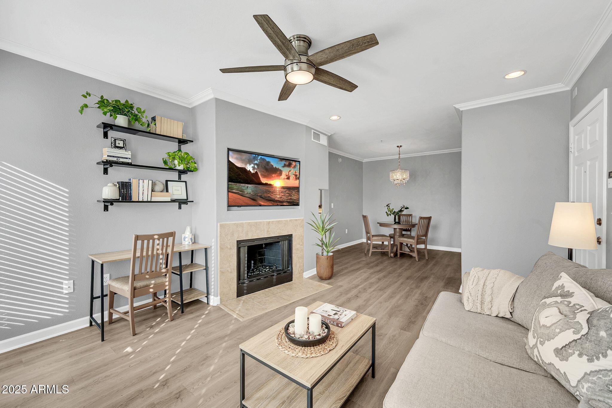 7575 East Indian Bend Road, Unit 2085 Scottsdale, AZ 85250 - Photo 7 of 30 a living room with furniture fireplace and a table