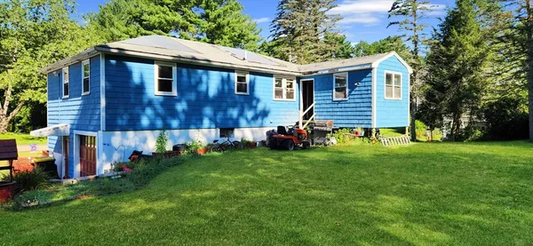 front view of a house with a yard