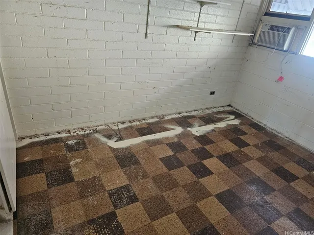 a bathroom with a window and a shower