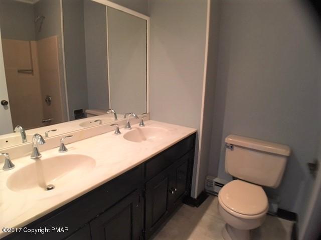 567 Snow Hill Road Cresco, PA 18326 - Photo 14 of 17 a bathroom with a sink toilet and a mirror