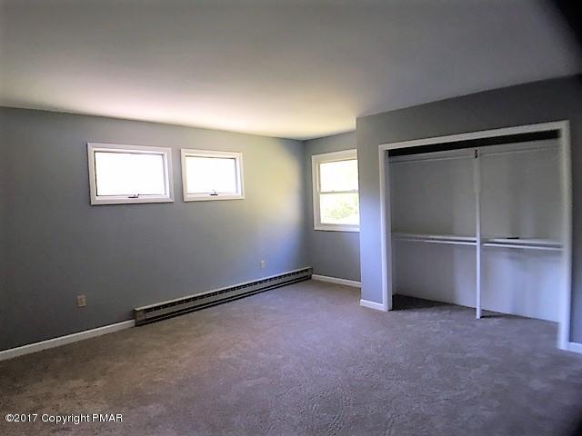 567 Snow Hill Road Cresco, PA 18326 - Photo 8 of 17 a view of an empty room with a window