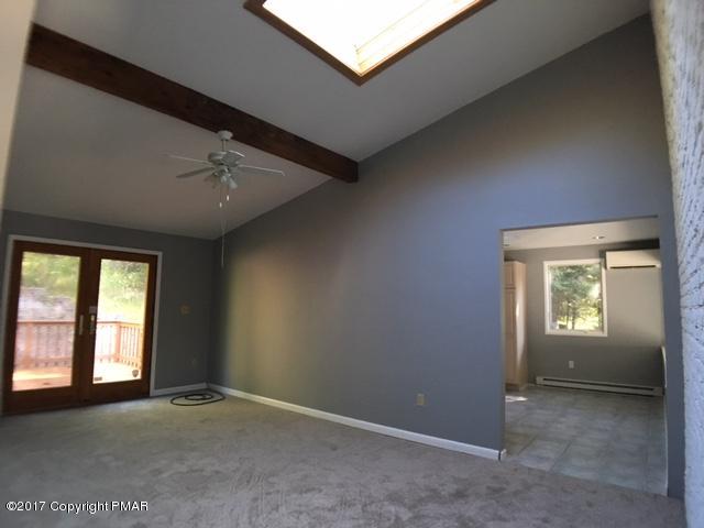 567 Snow Hill Road Cresco, PA 18326 - Photo 9 of 17 an empty room with windows