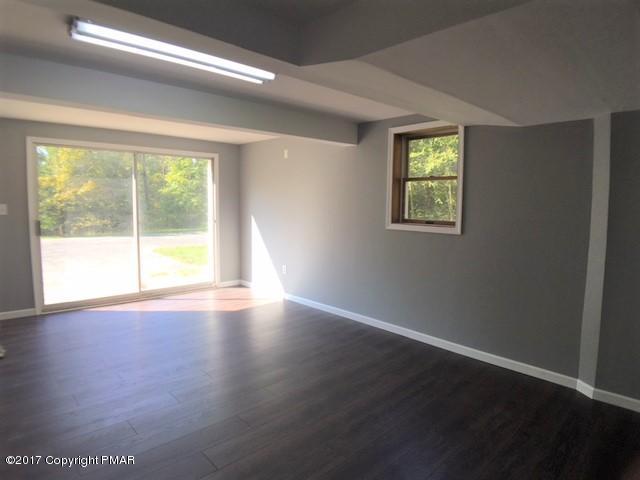 567 Snow Hill Road Cresco, PA 18326 - Photo 10 of 17 a view of an empty room with wooden floor and a window