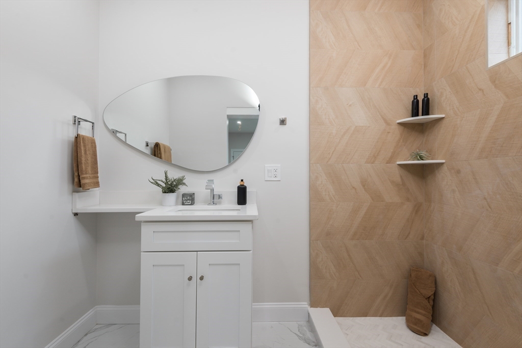 6 Gordon Road Arlington, MA 02474 - Photo 15 of 40 a bathroom with a sink a toilet and mirror