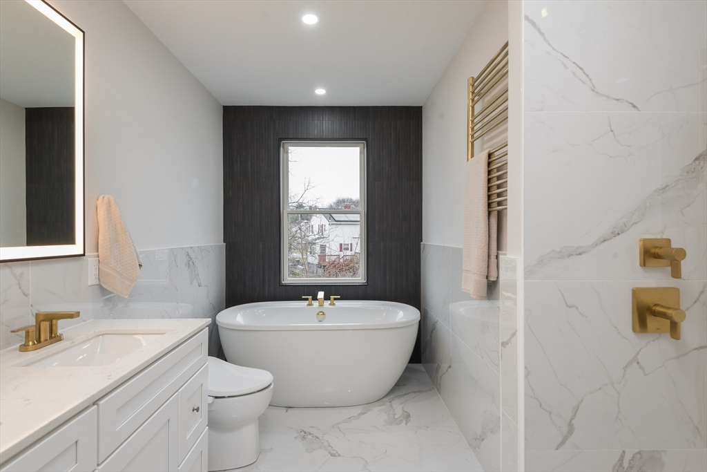 6 Gordon Road Arlington, MA 02474 - Photo 21 of 40 a bath room with a toilet sink and mirror