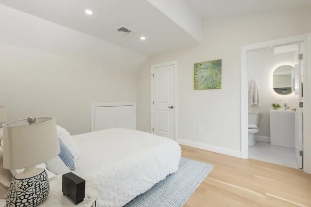 a bedroom with a bed and a view of bathroom