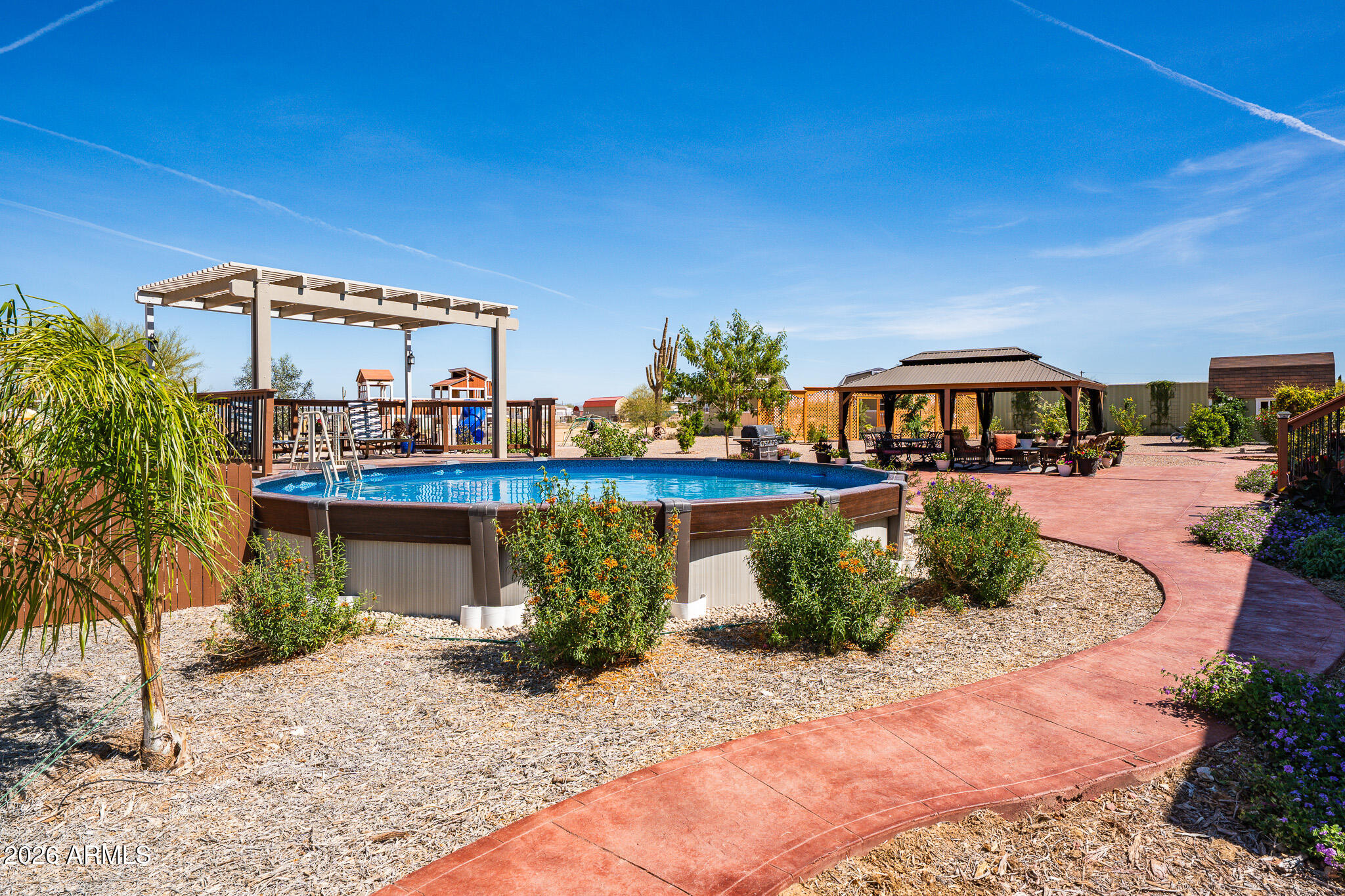 22622 East Day Spring Lane Florence, AZ 85132 - Photo 30 of 70 a view of swimming pool with outdoor seating