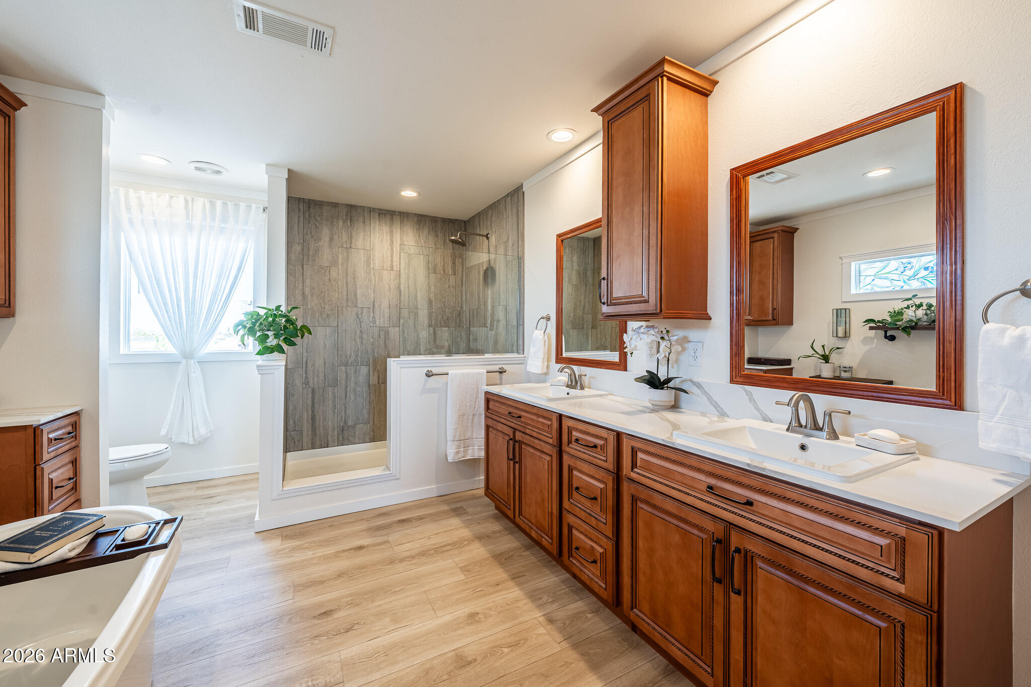22622 East Day Spring Lane Florence, AZ 85132 - Photo 4 of 70 a spacious bathroom with a double vanity sink a mirror and a shower