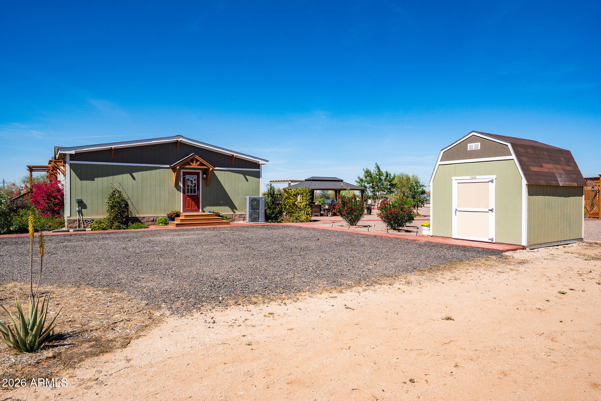 22622 East Day Spring Lane Florence, AZ 85132 - Photo 64 of 70 a front view of a house with a yard and garage