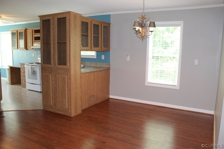 403 John Randolph Road Farmville, VA 23901 - Photo 11 of 23 an empty room with wooden floor and windows