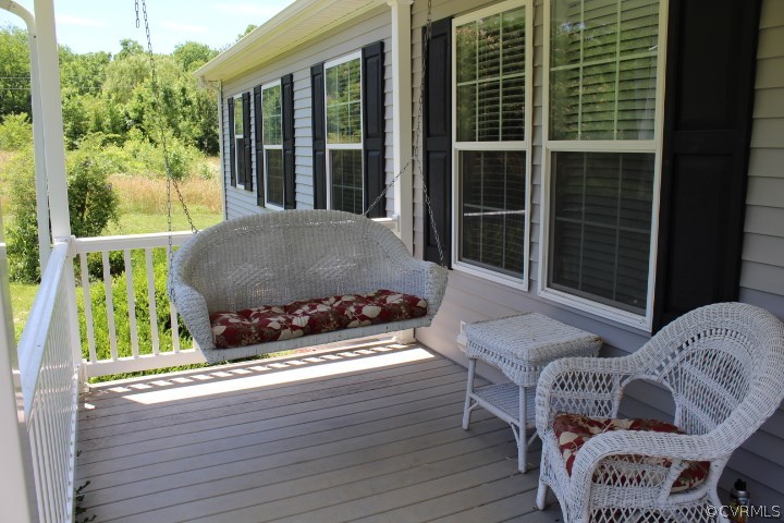 403 John Randolph Road Farmville, VA 23901 - Photo 15 of 23 a living room filled with furniture and a floor to ceiling window
