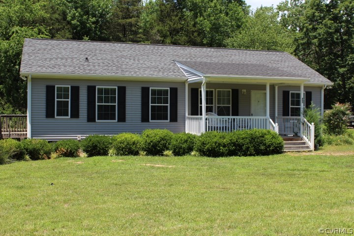 403 John Randolph Road Farmville, VA 23901 - Photo 21 of 23 a view of a brick house with a yard plants and large trees