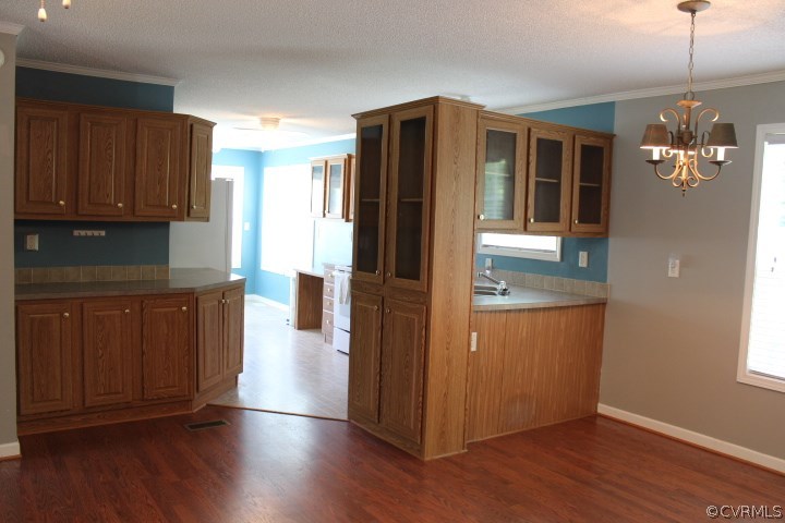 403 John Randolph Road Farmville, VA 23901 - Photo 10 of 23 a kitchen with stainless steel appliances granite countertop wooden floors and granite counter tops