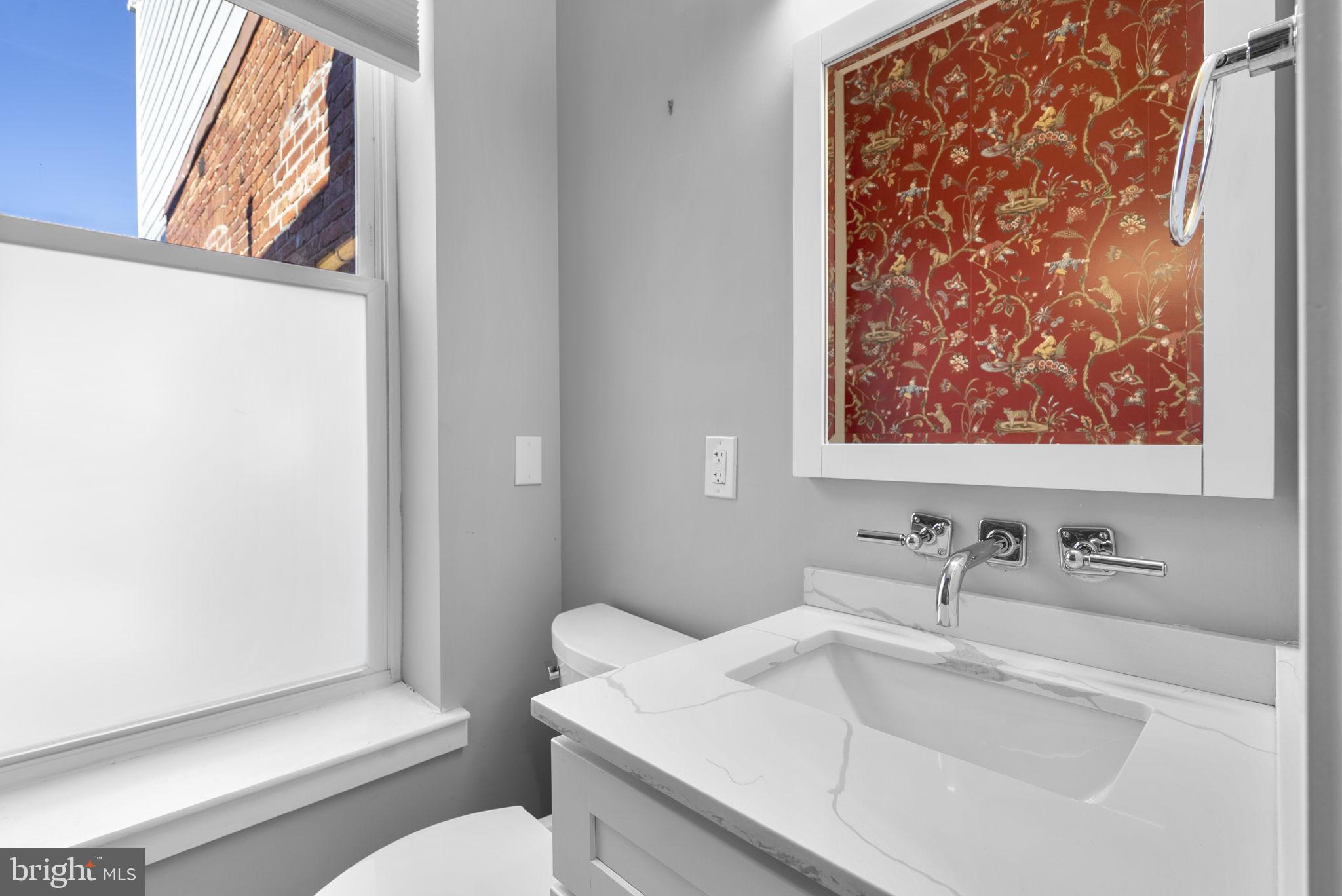 3572 13th Street Northwest, Unit 2 Washington, DC 20010 - Photo 12 of 26 a bathroom with a sink and a toilet